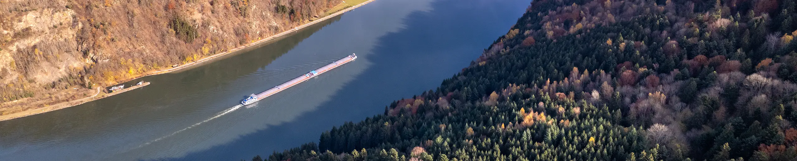 pusher boat transporting cargo along river