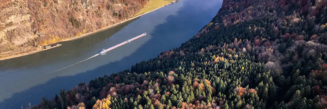 pusher boat transporting cargo along river