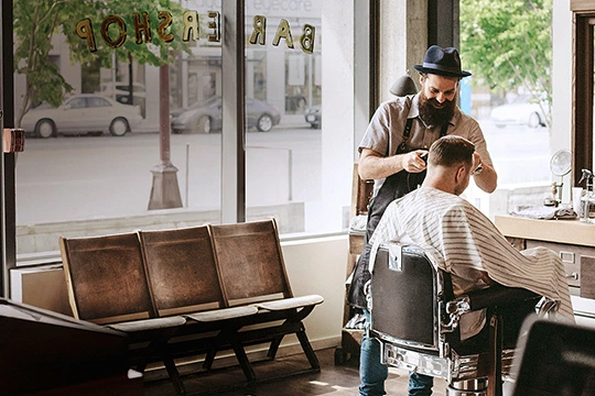 A hair cutter in his shop