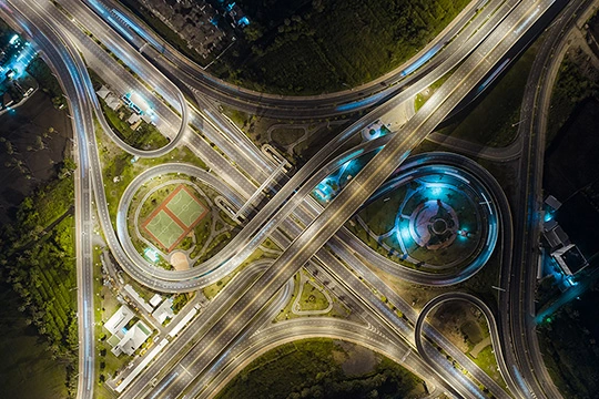 illuminated crossroads at night 