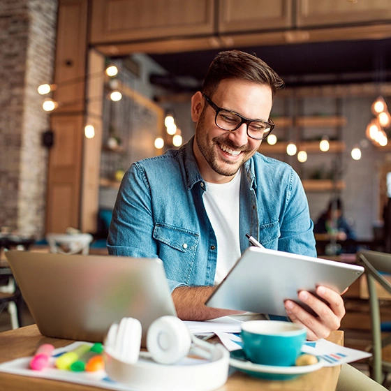 A man with his laptop and tablet