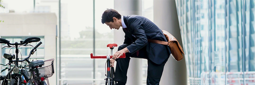 a man in a suit with his bike