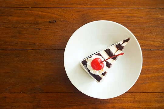 A piece of cake on white dish