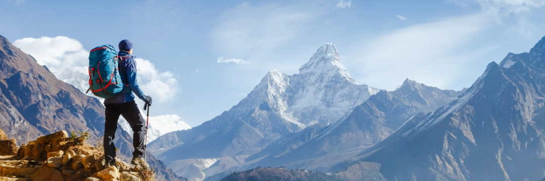 a climber looks down into the valley